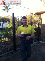 Black motorized steel gate made and installed by Allouch Engineering in Victoria